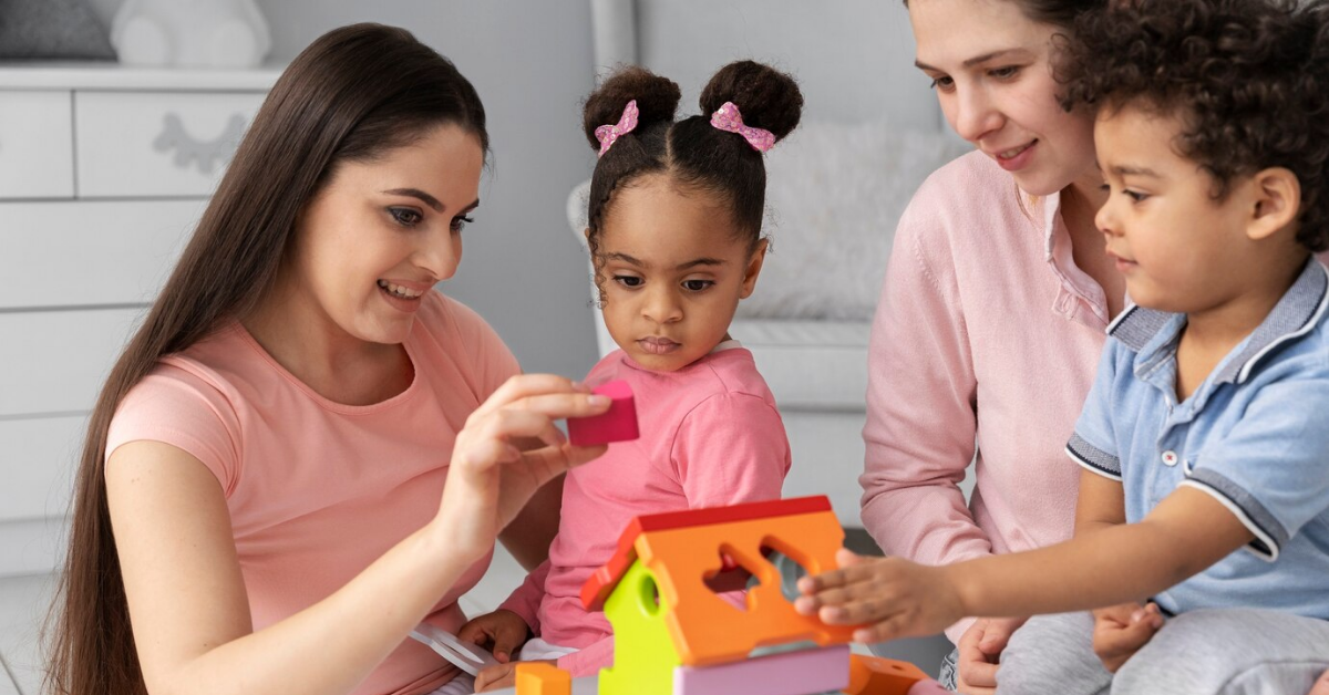 A group of people are sitting around a table playing with toys.