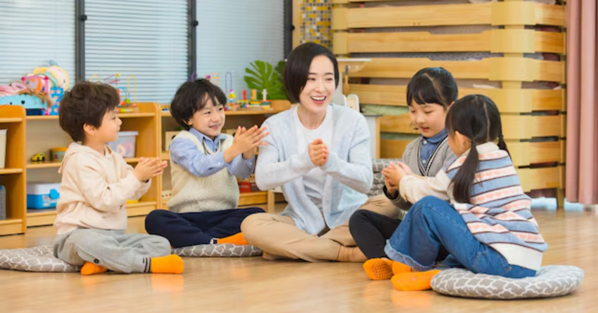 A group of children are sitting on the floor with a teacher.