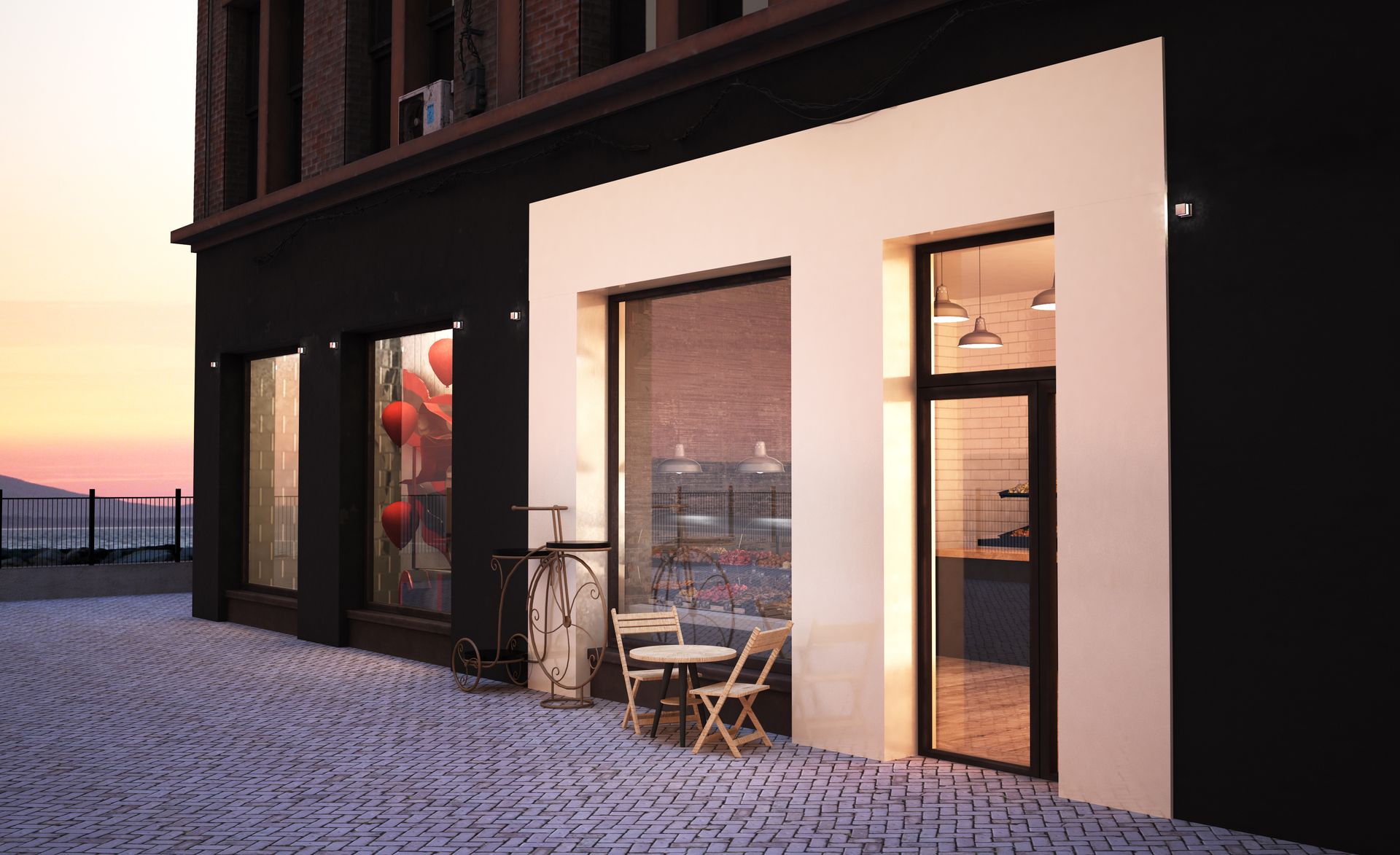 A storefront shop overlooking a mountain range at dusk.