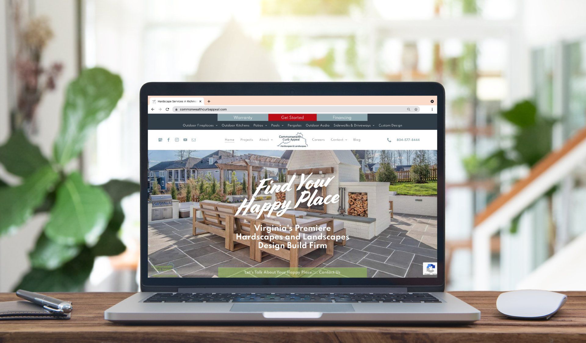 A laptop computer is sitting on a wooden table.