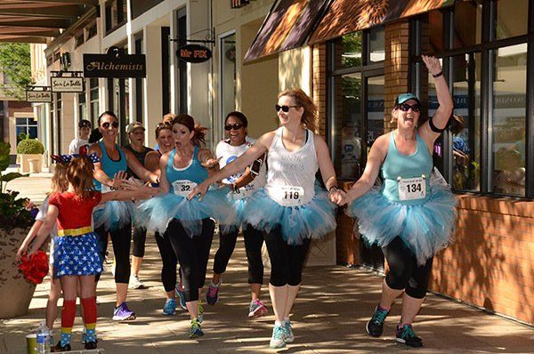 Women in Blue tutus for hitting cancer below the belt