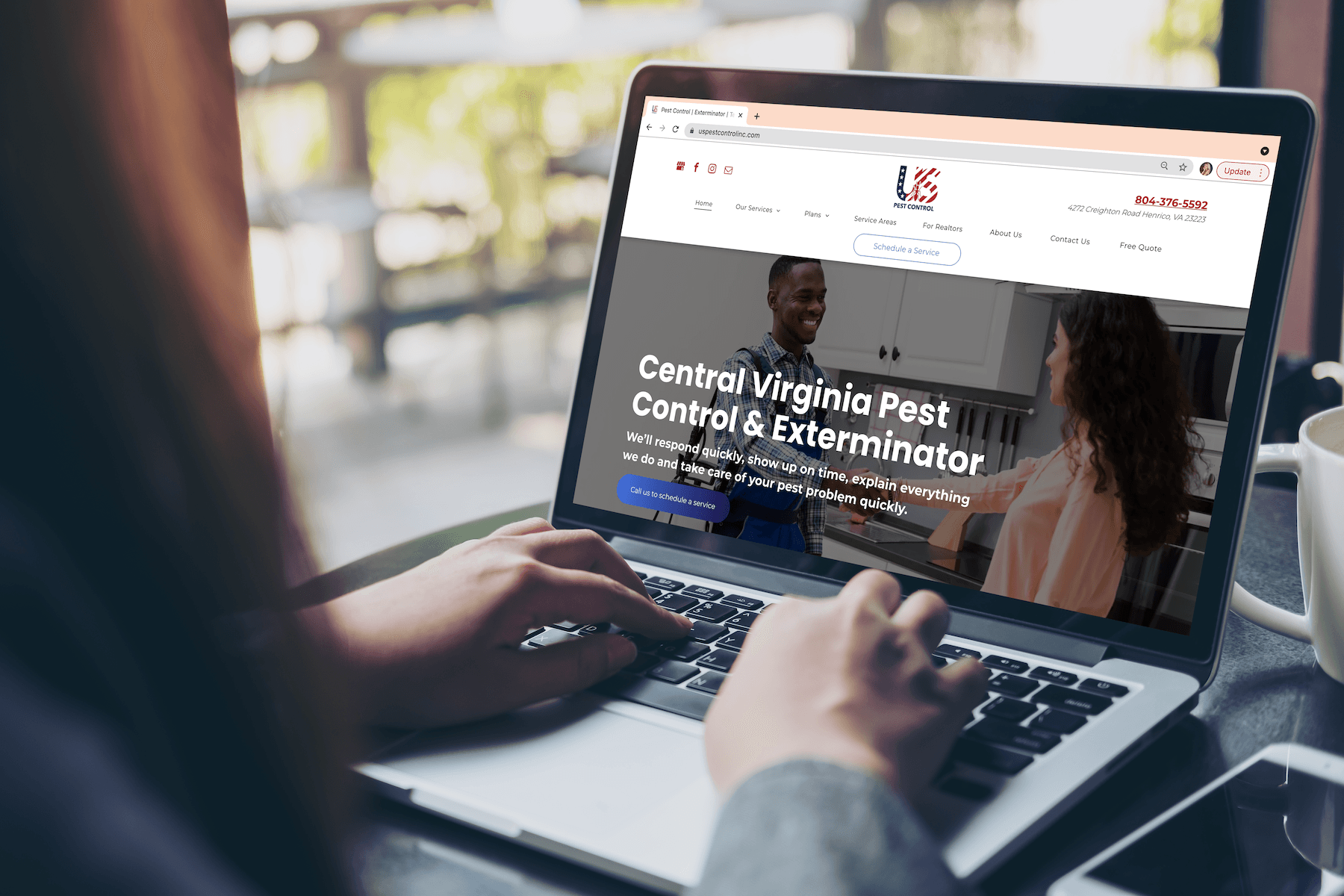 A person is typing on a laptop computer.