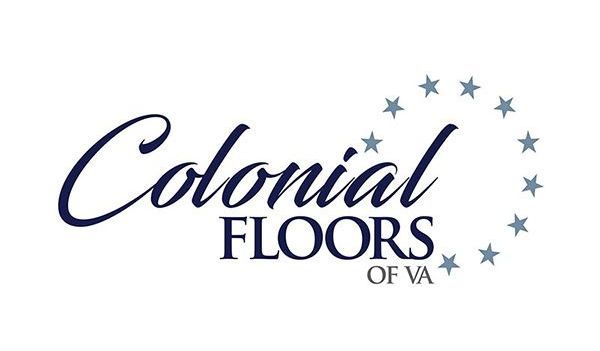 The logo for colonial floors of va is blue and white with stars.