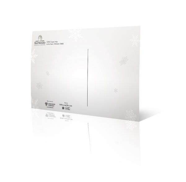 A white envelope is sitting on a white surface.