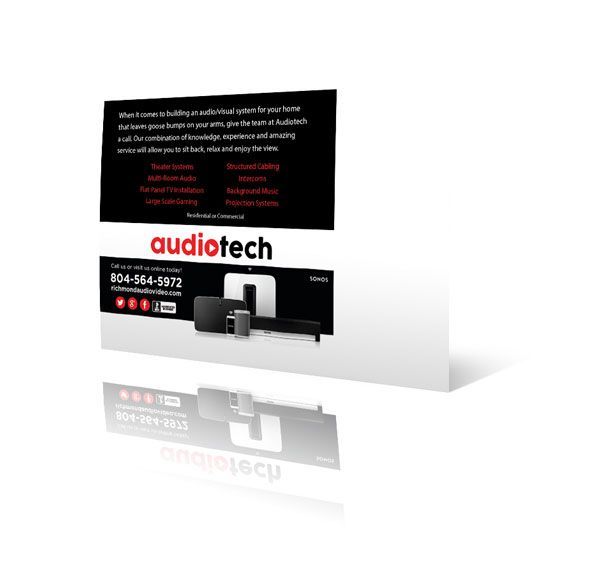 A business card for audiotech with a picture of a speaker on it