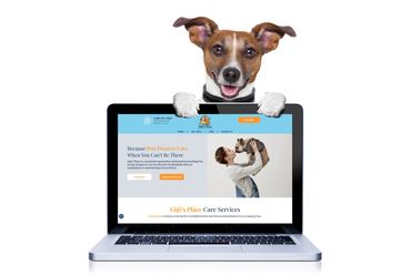 Dog peeking over a laptop screen displaying a website about pet care.