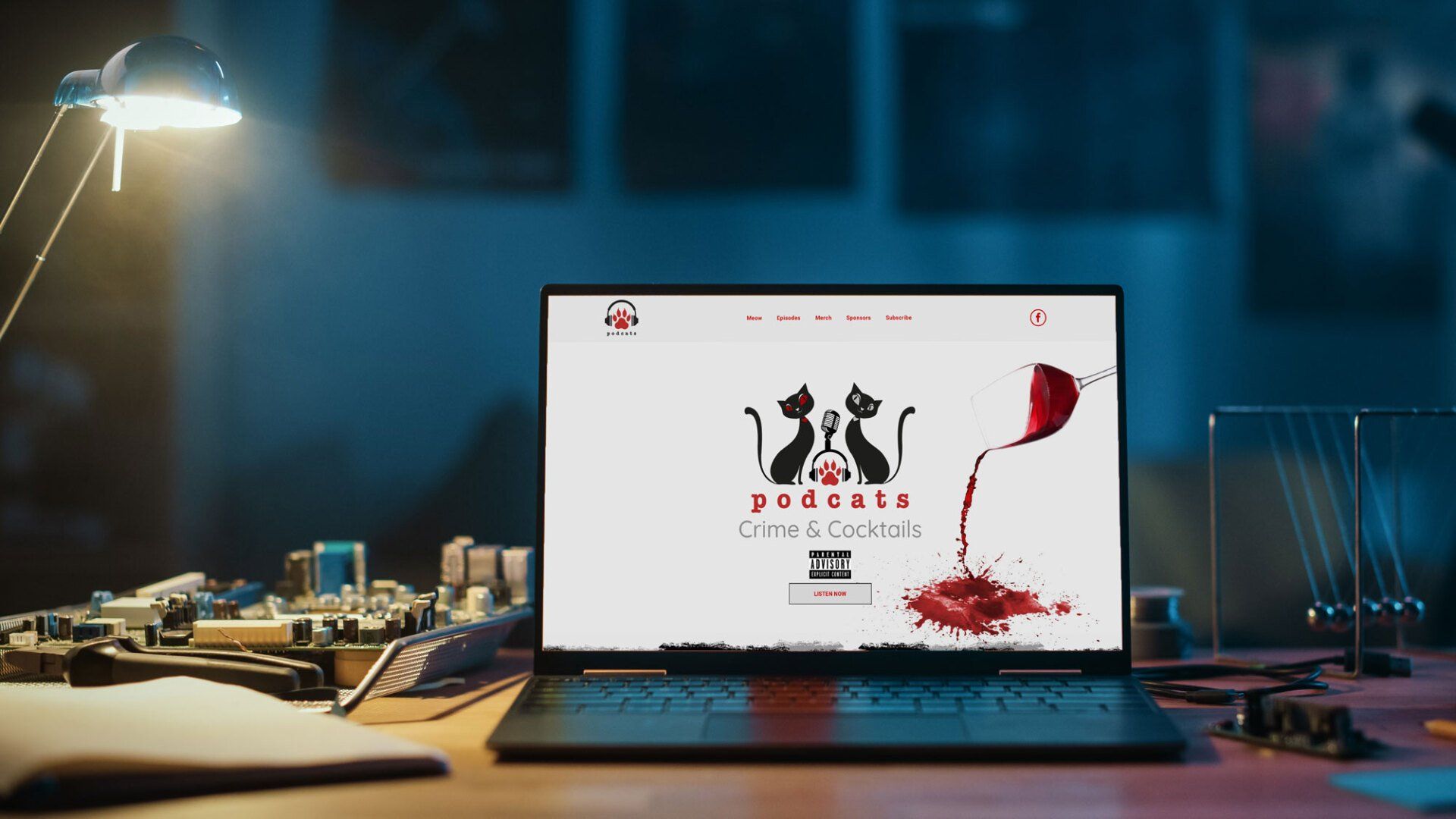 A laptop computer is sitting on top of a wooden desk.