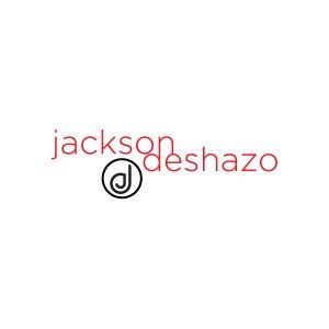 A red and black logo for jackson deshazo on a white background.