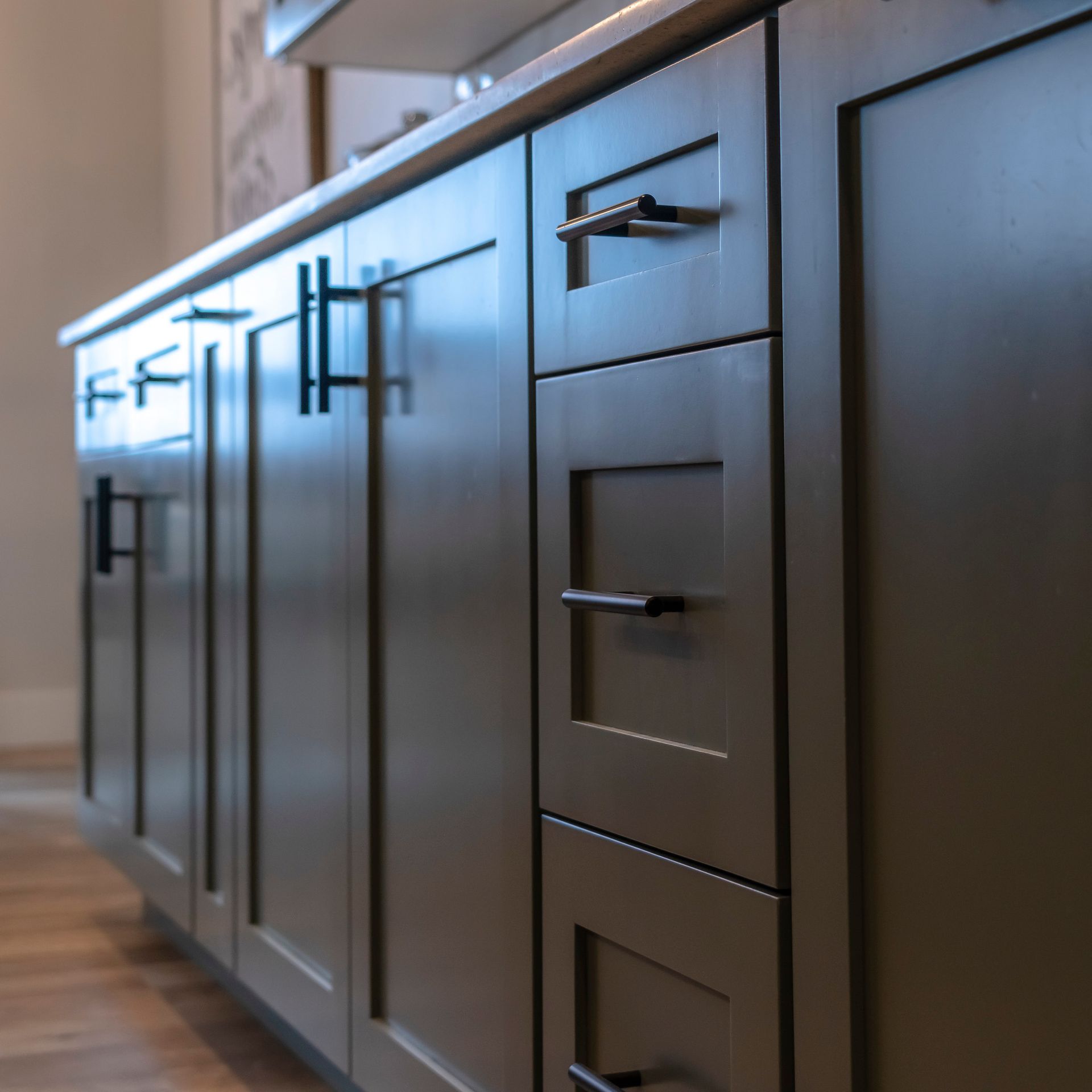 A kitchen with a lot of cabinets and drawers