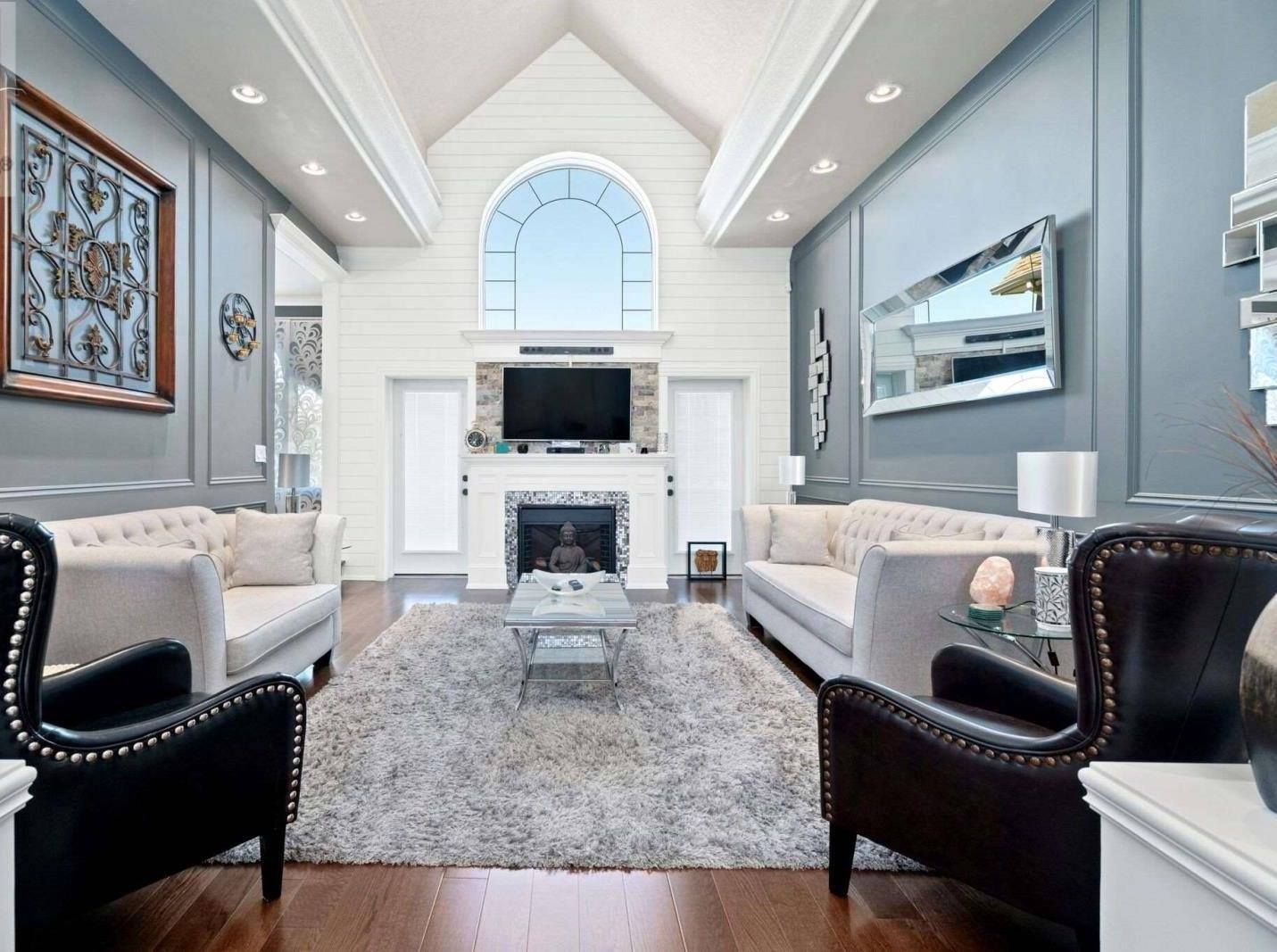 A living room filled with furniture and a fireplace.