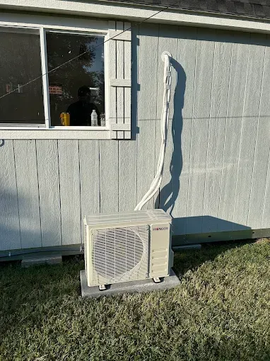 Hands in blue gloves on solar panels.