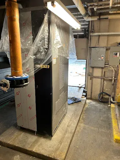 Solar panels on residential roof with a cloudy sunset.