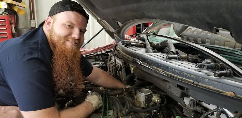 Mechanic working on engine | Lakeview Automotive