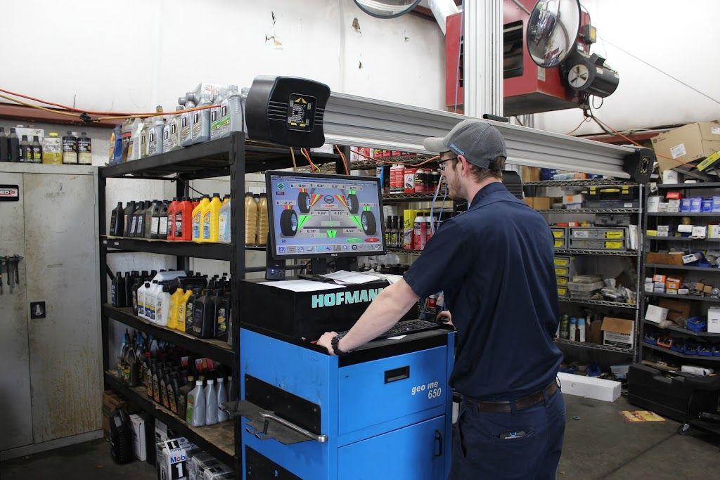 Mechanic working on alignment | Lakeview Automotive