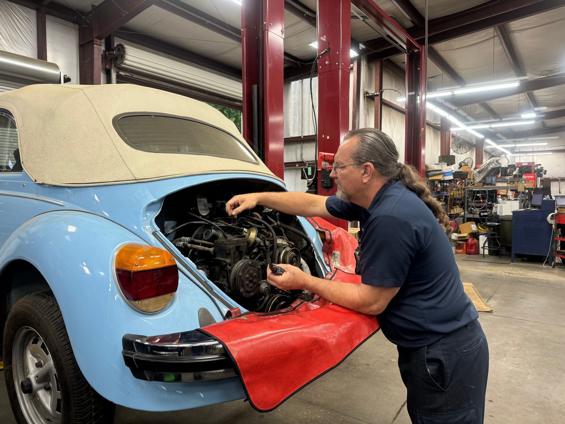 Mechanic working on engine | Lakeview Automotive