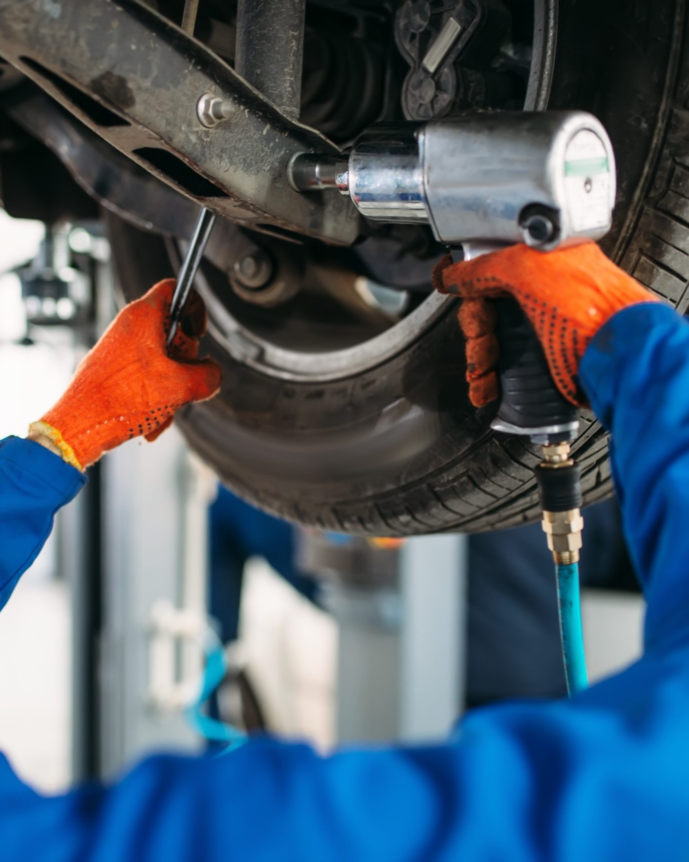 mechanic working on brakes
