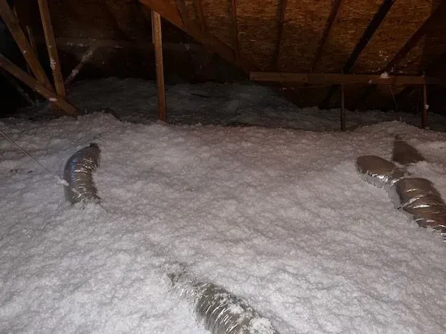 blow in insulation covering HVAC