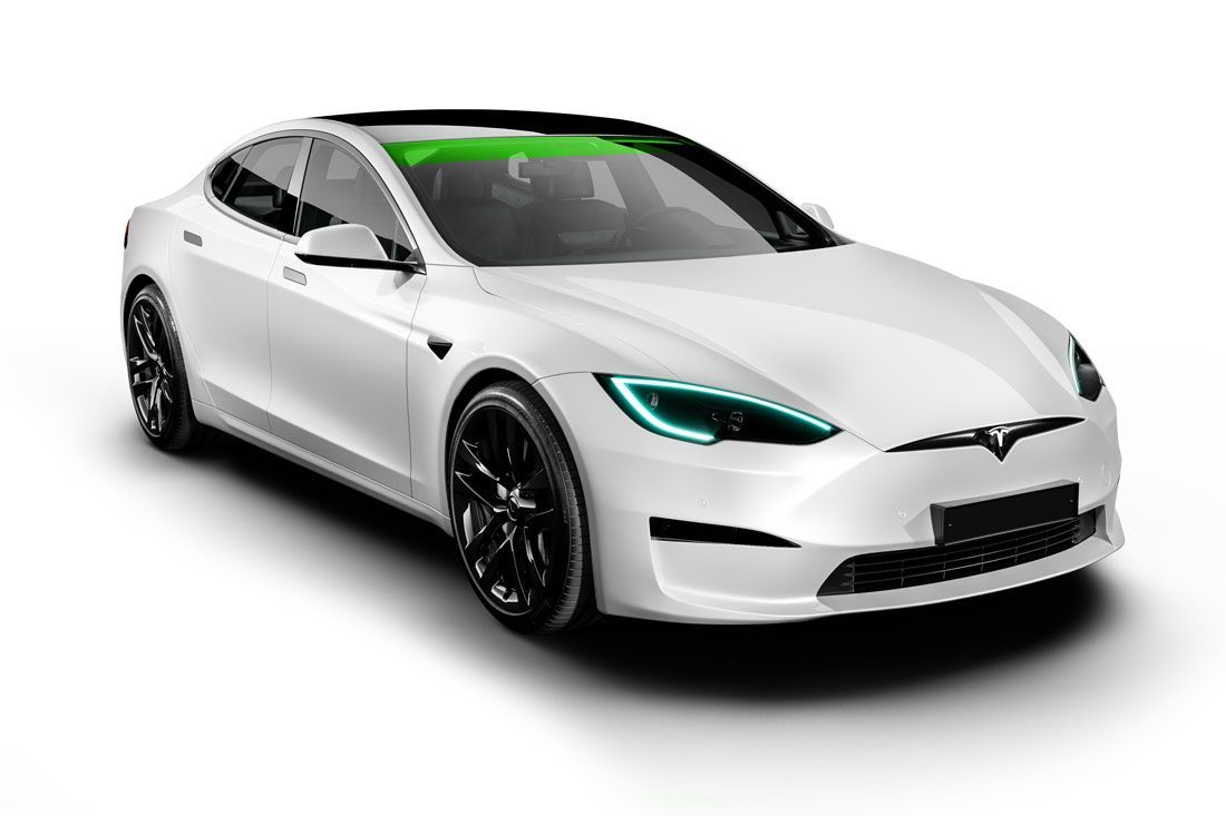 White Tesla sedan with black wheels and a green bar across the windshield.