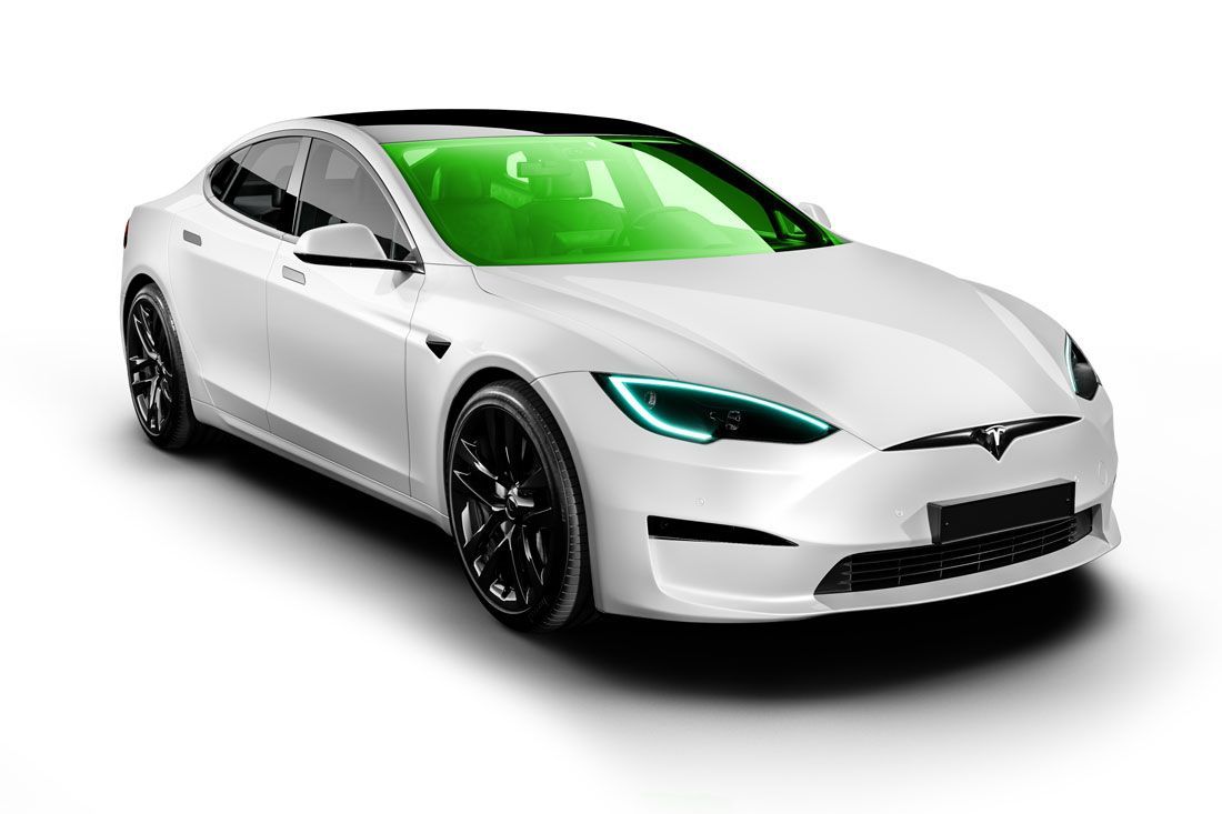 White Tesla electric car on a white background with green tinted windows and black wheels.