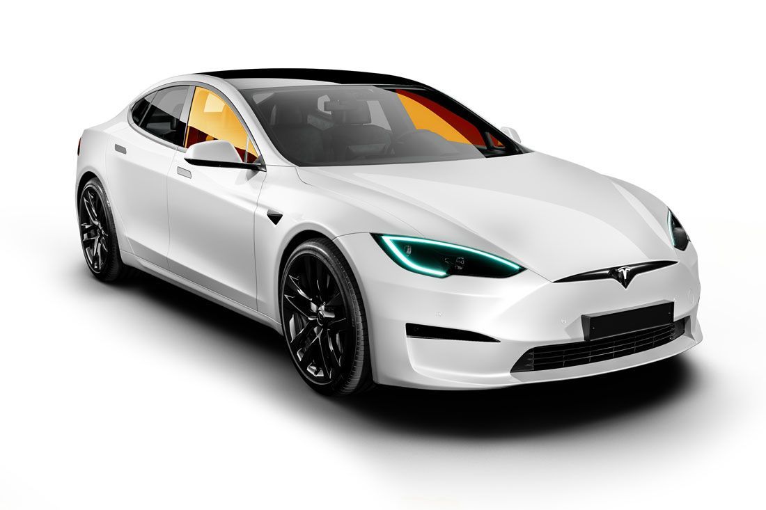 White Tesla Model S, parked, angled view with black wheels and tinted windows.