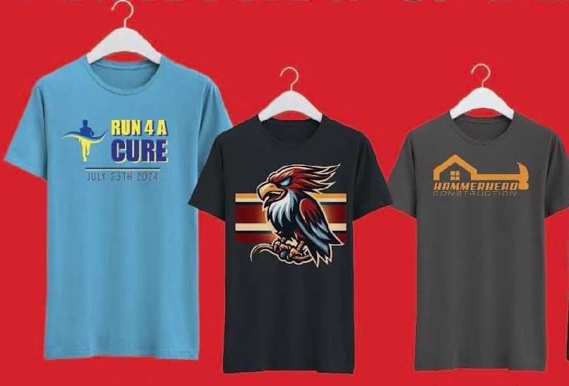 A bunch of t-shirts are stacked on top of each other.