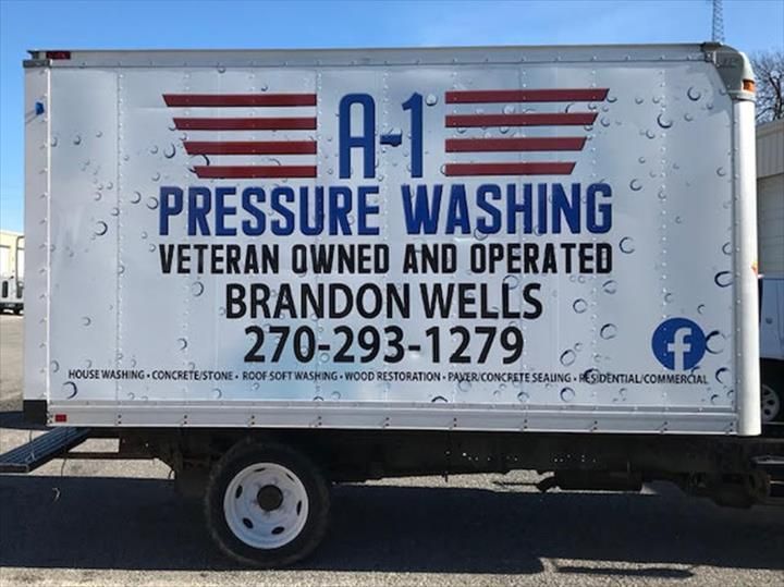 A white truck with the word pressure washing on it