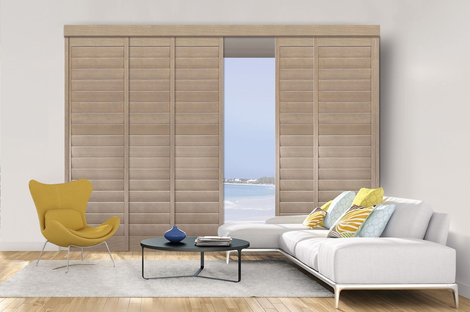 Light wood sliding plantation shutters covering a floor-to-ceiling window in a modern living room with a white sofa.