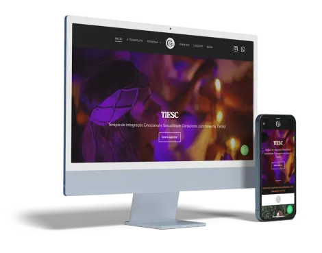 Computador desktop e smartphone exibindo um site com identidade visual em roxo e branco, mostrando uma imagem desfocada de um evento.