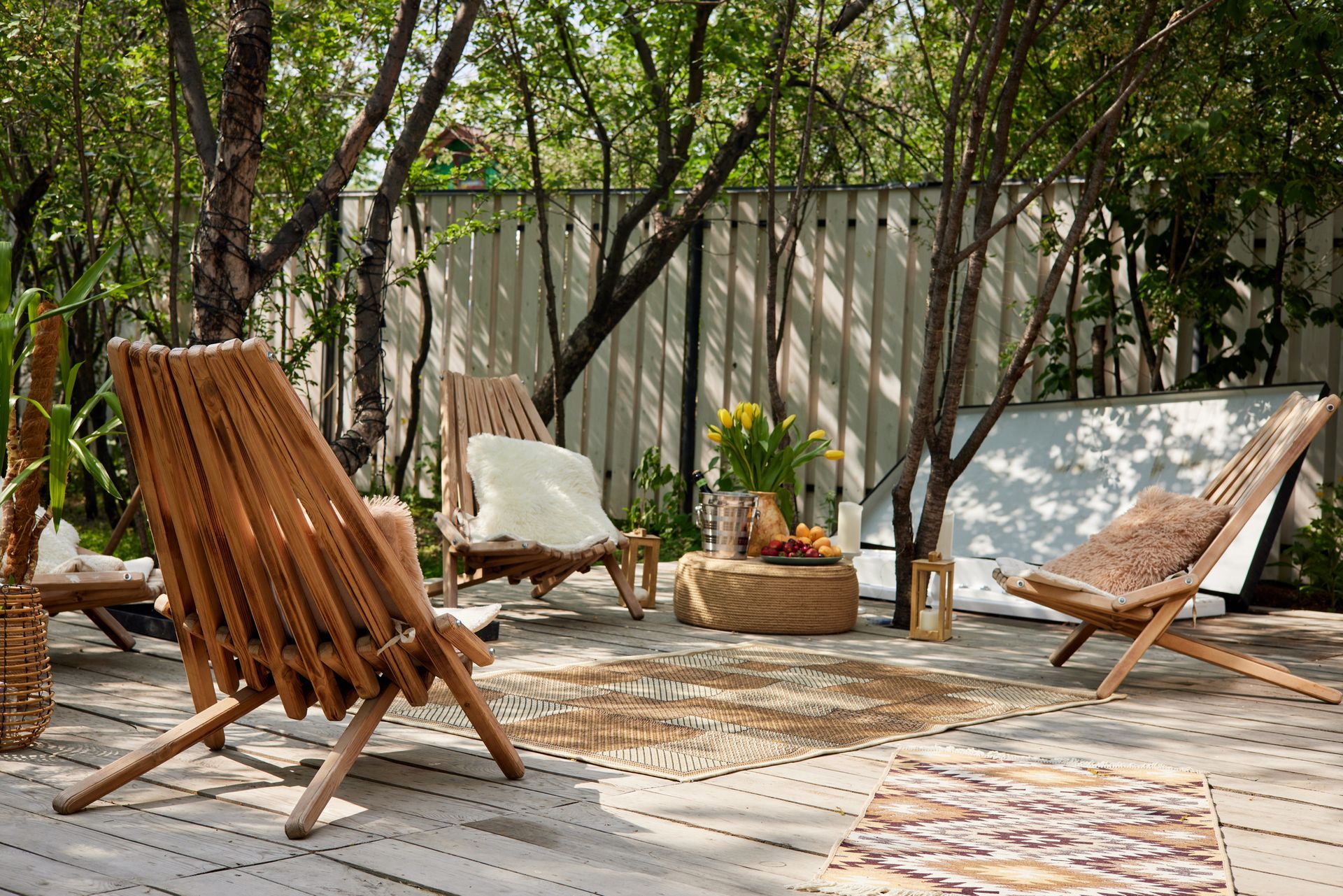 A Wooden Deck with Chairs, a Table and a Rug | Freehold, NJ | J & H Dinettes & Upholstery