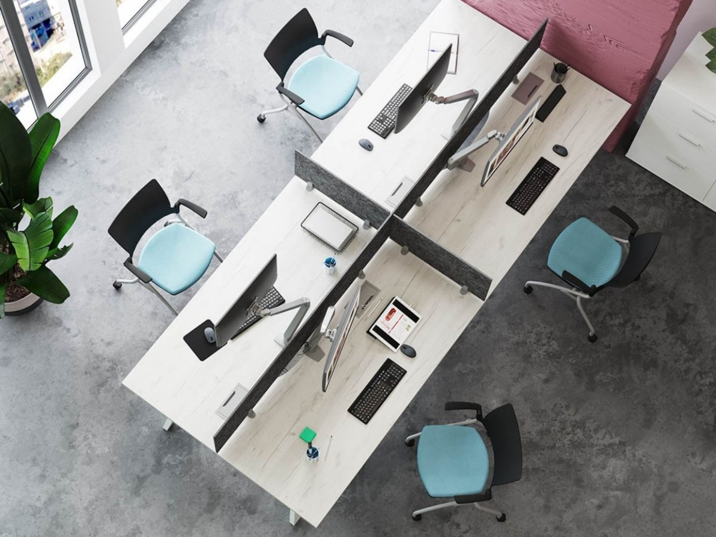 Office cubicle setup with light wood desks, blue chairs, and computers.
