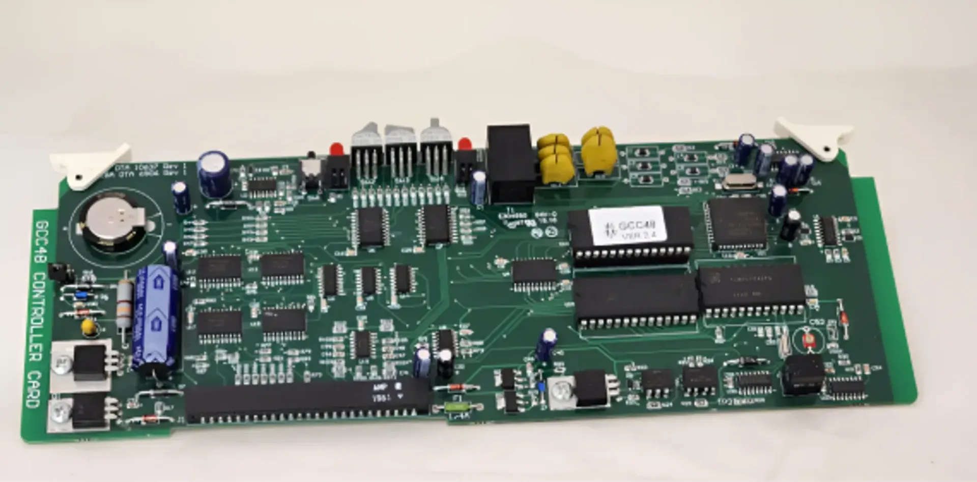 A motherboard with a battery on top of it