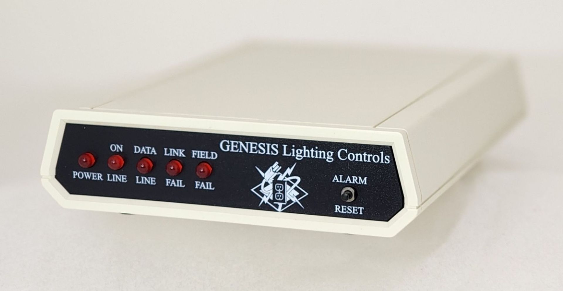 A genuse lighting controls device is sitting on a white surface