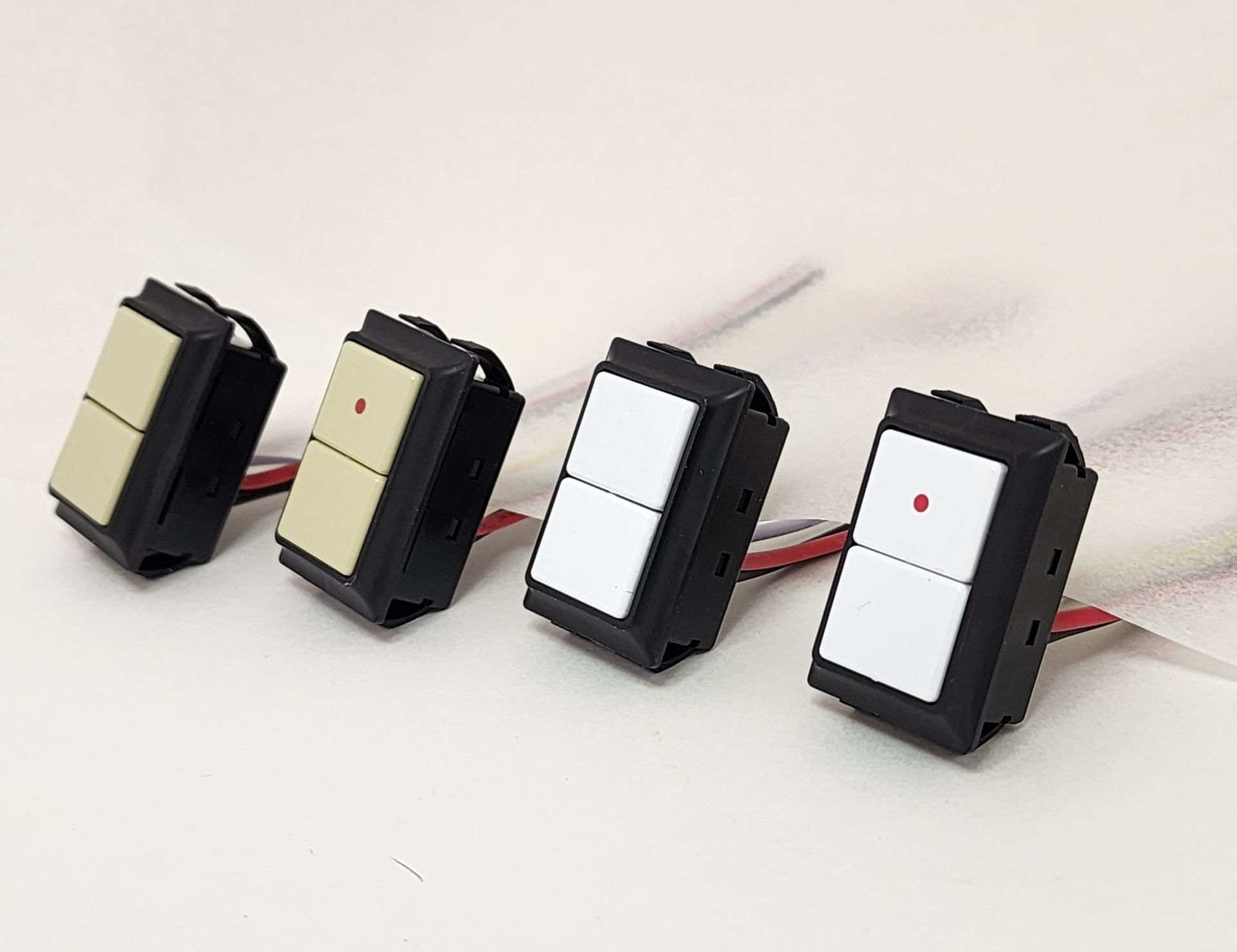 A row of light switches are lined up on a table