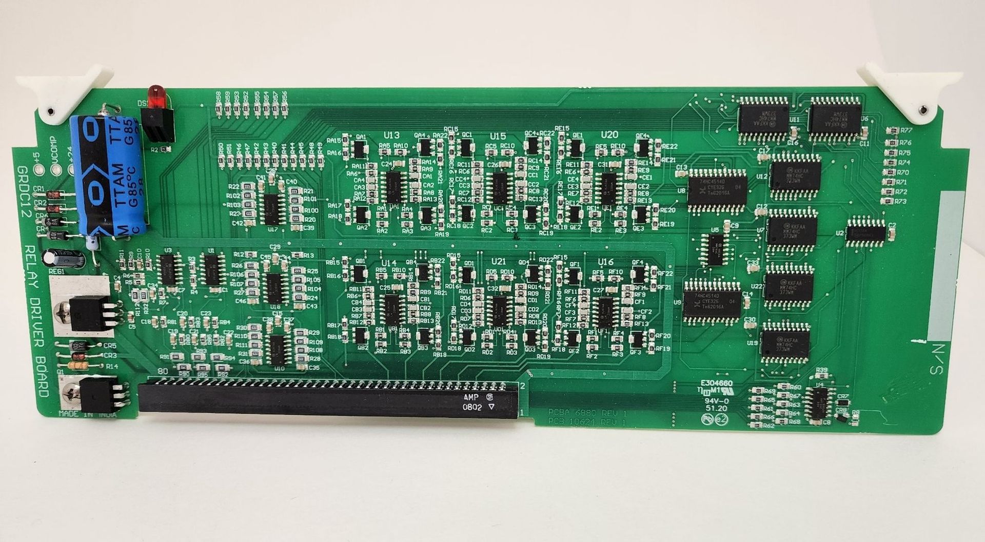 A green motherboard with a lot of electronic components on it
