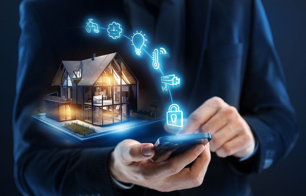 A man is holding a smart phone with a house coming out of it.