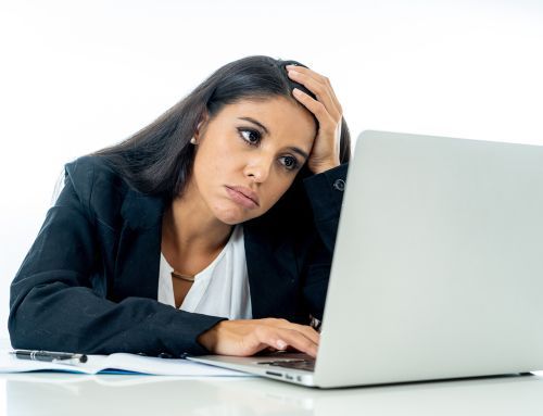 Frustrated worker at laptop