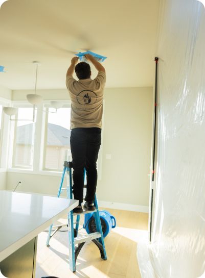 A man on a ladder with the number 5 on his back