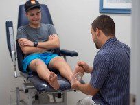 Podiatrist Marc Udovisi treating a patient in the Hervey Bay Family Feet Podiatry practice