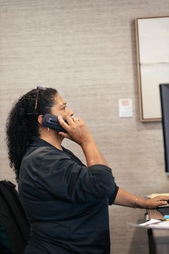 Woman talking on the phone | Larsen Automotive Inc