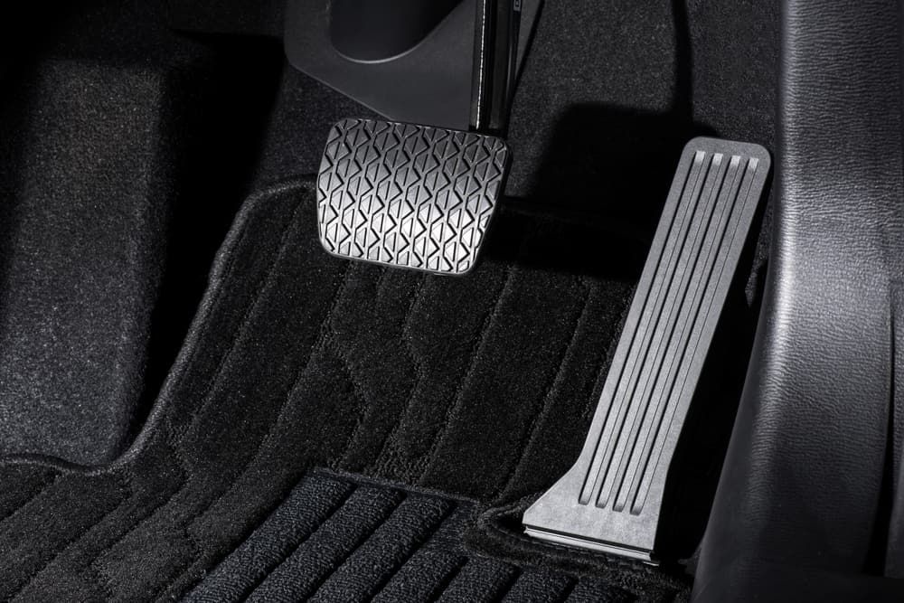 A Close Up Of A Car Pedal On A Black Mat — Automotive Repair Centre In Garbutt, QLD