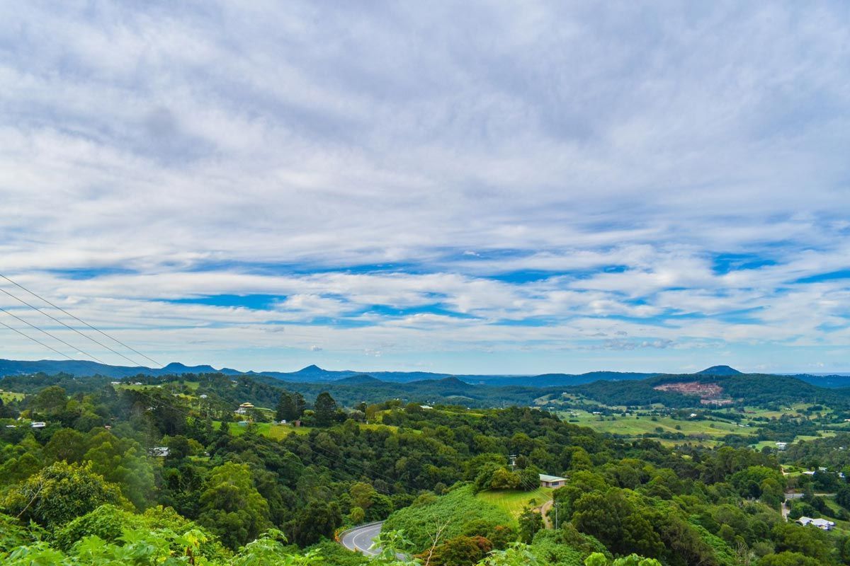 A View of a Lush Green Forest With Mountains in the Background on a Cloudy Day — Aquaman Watàr Deliveries In Mooloolah Valley, QLD