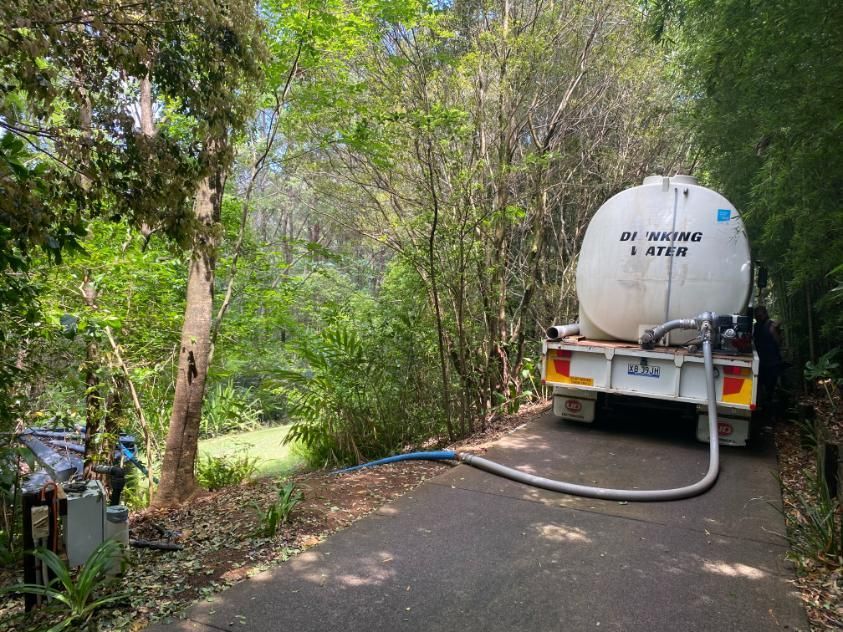 A White Water Truck Is Parked On The Side Of A Road — Aquaman Watàr Deliveries In Sunshine Coast Hinterland, QLD