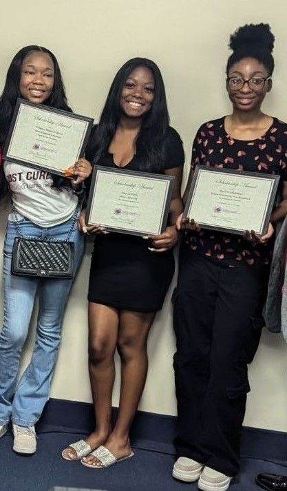 Three 2024-2025 Donna T Derrien Foundation for Sickle Cell scholarship winners  standing next each other holding their awards