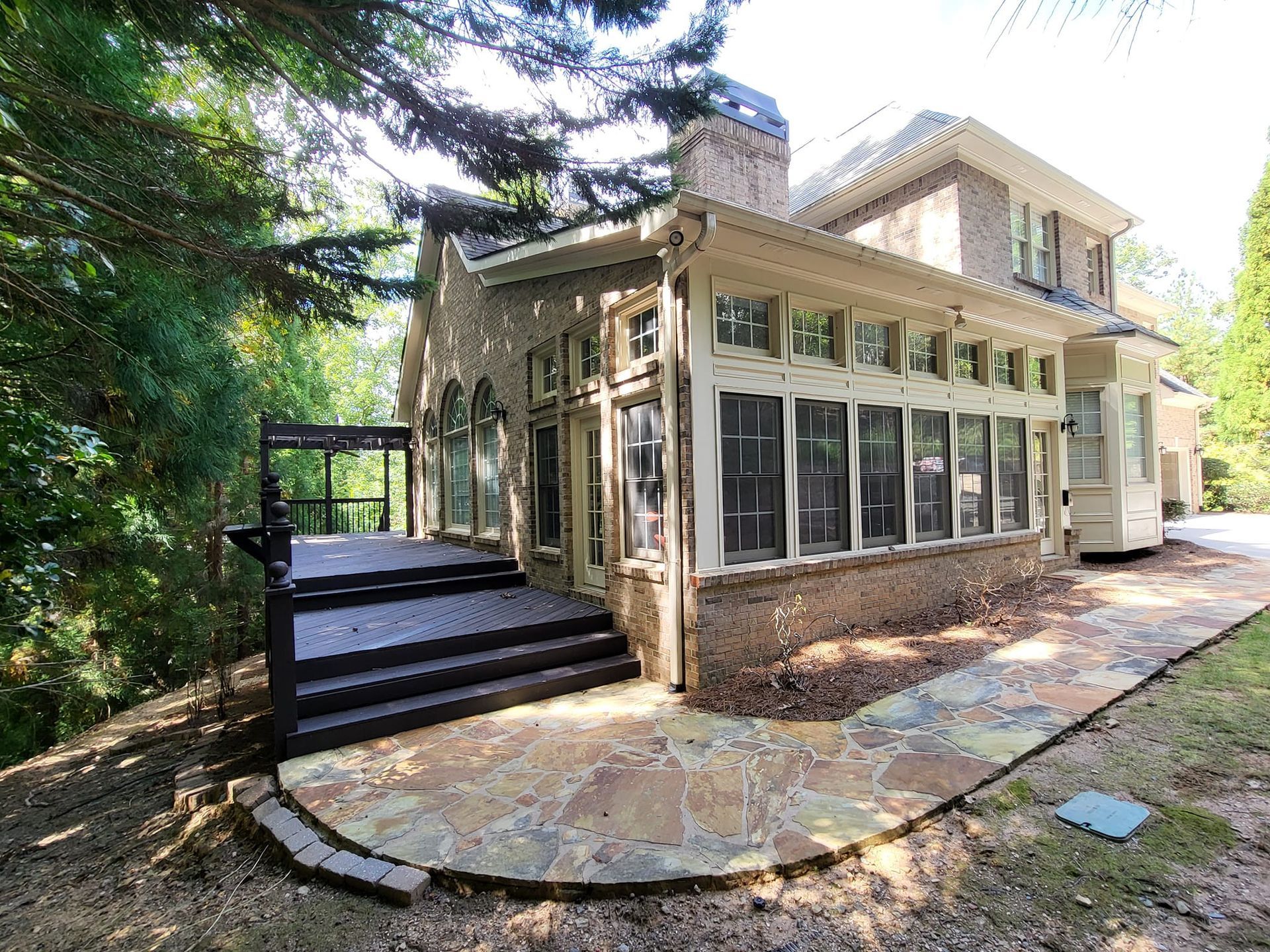 A large house with a walkway leading to it