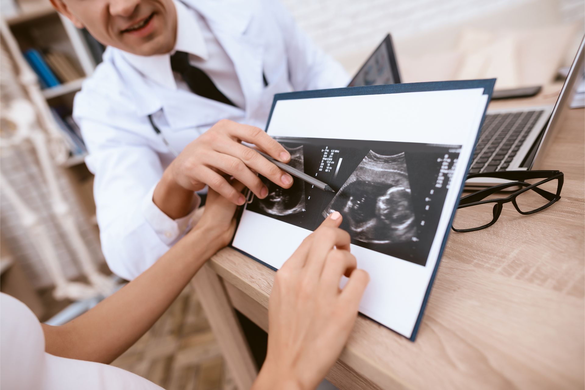 Doctor and patient looking at sonogram
