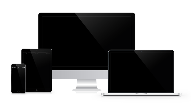 a computer , laptop , tablet , and cell phone on a white background .