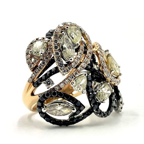 White baguette diamonds encircle an oval diamond in this stunning ring at Gold Galore Jewelry