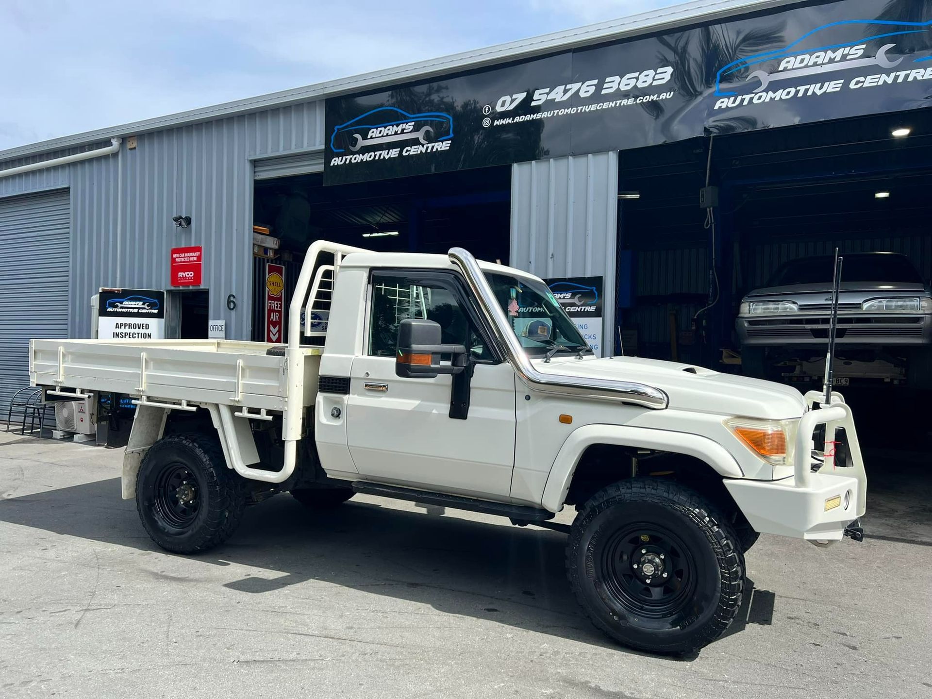 White Pickup Truck Parked in Front of an Automotive Center — Adam's Automotive Centre in Nambour, QLD