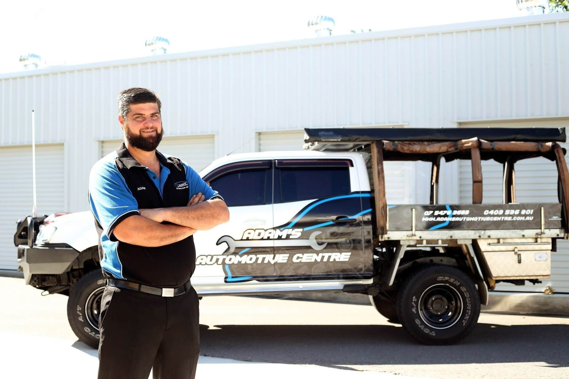 Man With Arms Crossed in Front of a White Truck With — Adam's Automotive Centre in Nambour, QLD