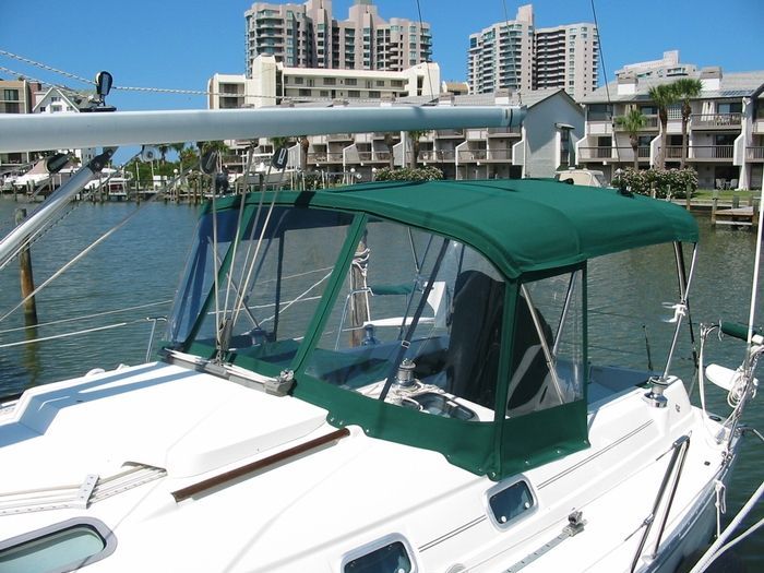 A person is holding a zipper in their hand.